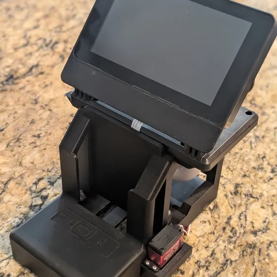 Custom electromechanical device: a 3D-printed chassis with a motorized tilting display and servo
